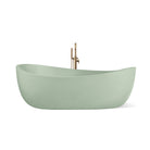 Hawaii freestanding concrete bathtub with wave-inspired design shown from front angle in a muted sage green shade known as Pistachio.