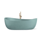 Hawaii freestanding concrete bathtub with wave-inspired design shown from front angle in a soft sea-toned blue-green shade known as Turquoise.